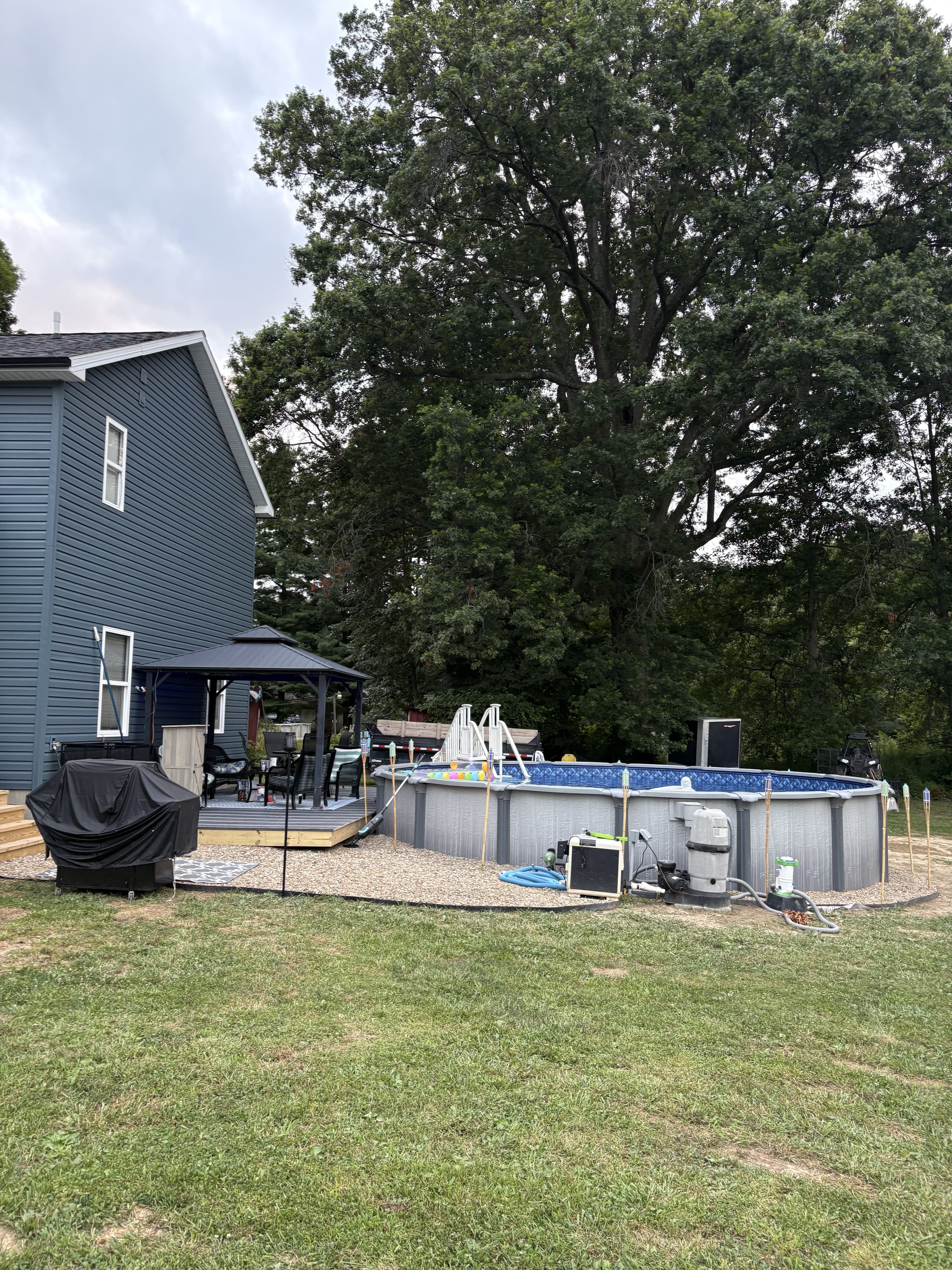 Finished backyard deck and pool area after the outdoor living upgrade was completed.